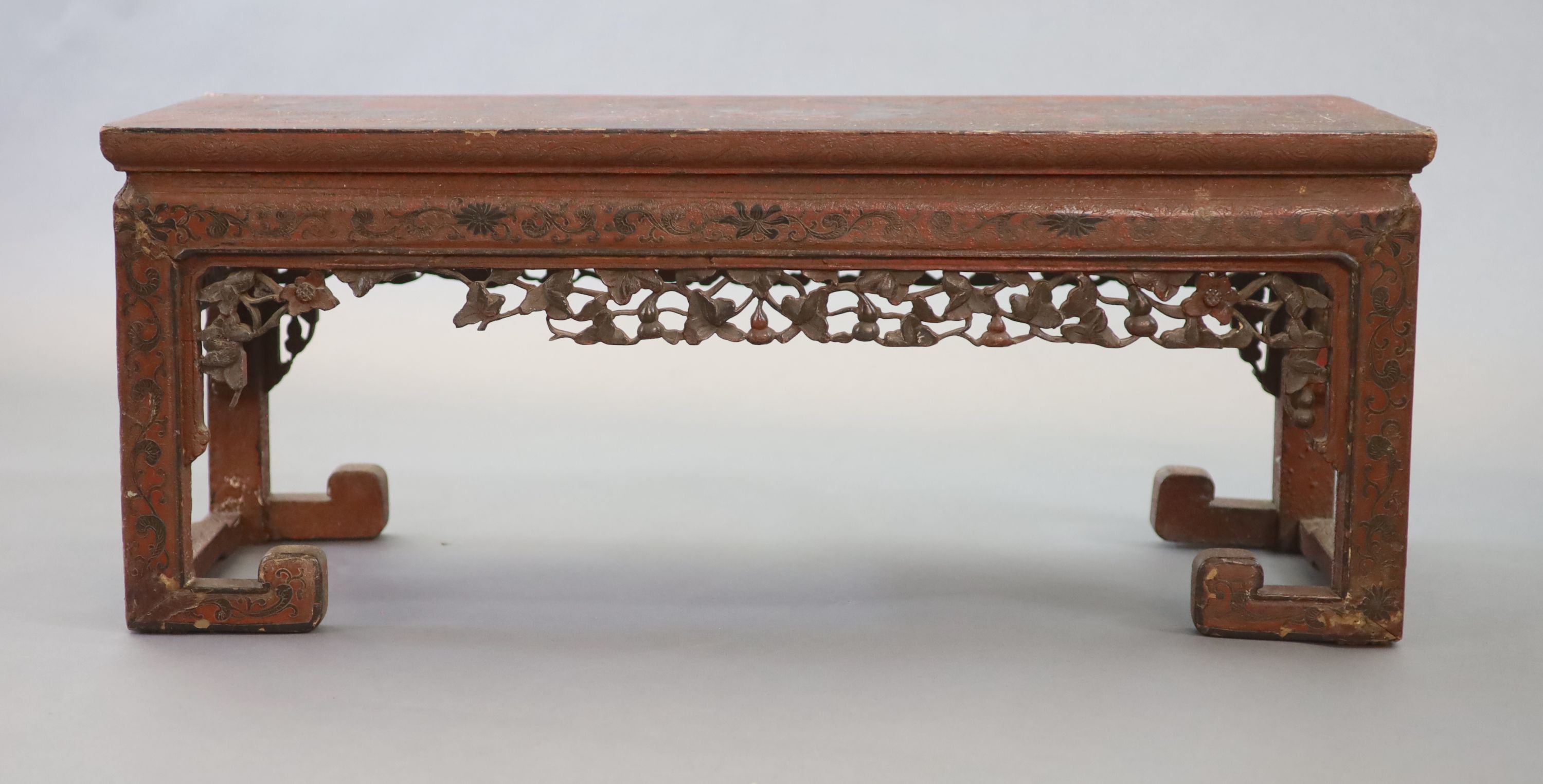 A Chinese coromandel lacquer table or stand, 18th century, 88cm long, 31.5cm long, 35cm high, losses